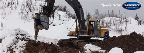 skid steer digging in frozen ground|deep freeze ground excavation.